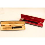 Two mid 20th Century fountain pens with 14ct gold nibs, Sheaffer and Parker