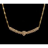 A diamond necklace, diamond set cluster detail set to the front to a bamboo link chain in 18ct gold,