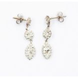 A pair of diamond set drop earrings, comprising two round brilliant cut diamonds and a marquise
