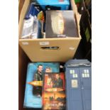 A collection of Dr Who ephemera including books, tins and figures (Q)
