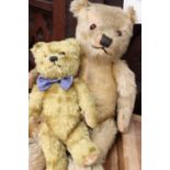 A pair of vintage teddy bears to include: 20" with growler; and a 12" with jointed limbs. (2)