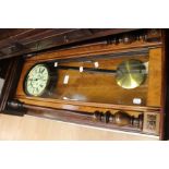 A late 19th Century pendulum wall clock, in mahogany case, approx 130 cms long