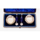 A cased pair of silver shell salts, Birmingham 1894, matching spoons (both repaired) William Henry