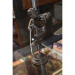 19th Century bronze figure of a fawn playing pipes, 25 cms high approx, unsigned