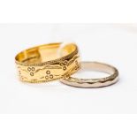 An engraved 9ct gold band, total gross weight 2.7 grams approx, along with an 18ct white gold band