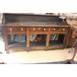 Early 18th Century three drawer oak dresser, brass handles, not original, with lower shelf and
