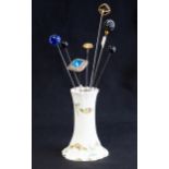 Early 20th century continental porcelain hat pin holder with bow and floral swag decoration to