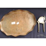 An Arts & Crafts copper tray; brass cigar cutter as a peacock