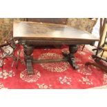 A mid 20th century small oak refectory table supported on baluster legs and central stretcher. The