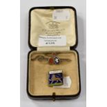 Two enamel badges including young conservatives and another in a leather box