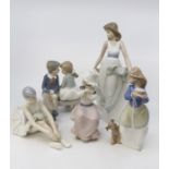 A collection of Nao figures of children and young ladies