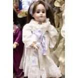 Armand Marseille bisque head doll, fully jointed composition body, open mouth with four teeth, 18"