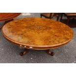A 20th Century Mahogany inlayed oval coffee table on pedestal with quadruped base with brass claw