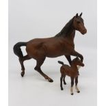 Two John Beswick bay ponies, matte small and large versions