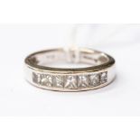A diamond set half eternity ring set with graduated Princess cut diamonds, 18ct white gold, size