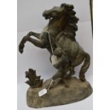 A spelter sculpture of a rearing horse and man