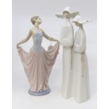 Two Lladro figures of a ballet dancer and a pair of nuns