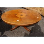 An early 20th Century mahogany coffee table, on brass castors