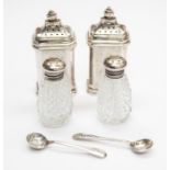 Two solid silver pepper pots, Birmingham 1928 Walker & Hall, of rectangular form with stepped