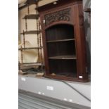 A late Victorian carved wall hanging corner open bookcase, circa 1890