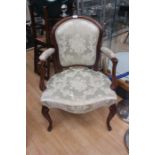 A mahogany pale green upholstered salon chair.