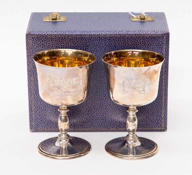 A cased pair of silver commemorative goblets, maker Perry Greaves, Birmingham 1973, with