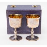 A cased pair of silver commemorative goblets, maker Perry Greaves, Birmingham 1973, with