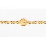 A 9ct gold ladies Jean Pierre watch, oval gold tone dial, batons on integral 9ct gold bracelet,