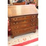 George III oak bureau, circa 1780, with fall enclosing pigeon holes and small drawers, above four