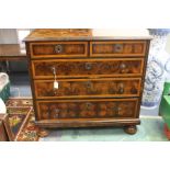 A Queen Anne walnut and laburnum oyster veneered chest of drawers, circa 1700, the crossbanded