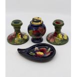 Moorcroft table lighter in hibiscus pattern, ash tray in orchid pattern and two hibiscus