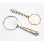 A modern silver handled magnifying glass, Sheffield 2005, maker B.D, with another silver handled