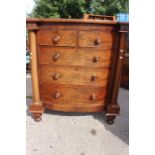 A Queen Anne style burr walnut caddy top chest of five long drawers, crossbanded with brass