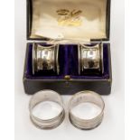 A cased pair of silver serviette rings (9) some wear Birmingham 1939, A&J Zimmermann Ltd, together