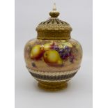 A Royal Worcester painted pot pourri vase and reticulated cover, gilt basket weave lower section