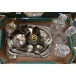 A collection of pewter and plated items including trays and three cut glass decanters