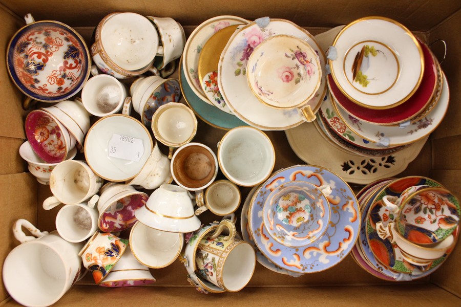 A collection of assorted British and Continental ceramic miniature cups and saucers