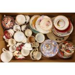 A collection of assorted British and Continental ceramic miniature cups and saucers