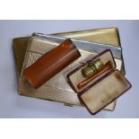 Two cheroot boxes and three cigarette cases, one cheroot box in leather case