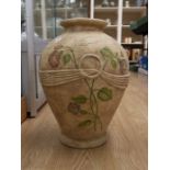 A large stone clay painted vase