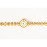 A 9ct gold ladies Rotary watch, round silvered dial with rope edge border, batons, dial diameter