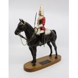 A Beswick Connoisseur Series life guard mounted horse, mounted on a wooden plinth (restorations)