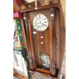 A late 19th Century drop pendulum wall clock, in mahogany case, approx 130 cms long, A/F
