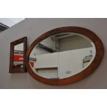 Two Arts and Crafts copper surround wall mirrors