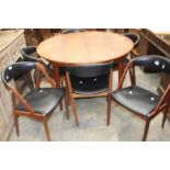 A 1970's Danish teak dining set, extendable dining table with six matching leather seating and