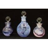 Three Caithness glass perfume bottles, different sizes and colours