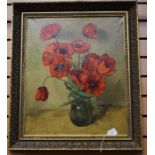A still life oil of poppies in vase, signature unclear, gilt frame