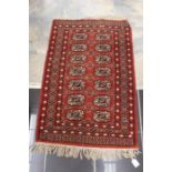 An Early 20th Century brown hand knotted rug 100cm x 66cm