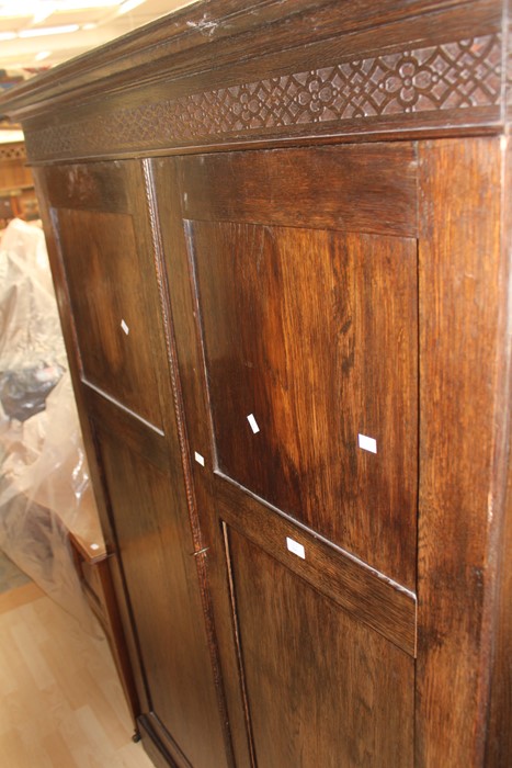 Late 19th Century to early 20th Century oak wardrobe with internal drawers and slide trays