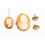 A cameo brooch with unmarked yellow metal surround probably 9ct gold with a similar pair of earrings